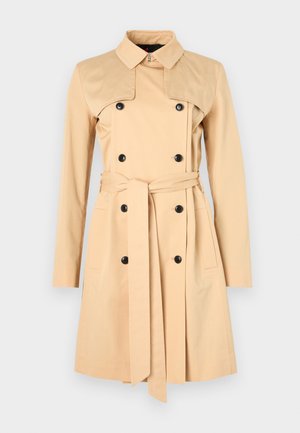 Beige trench coat with double-breasted buttons, a wide collar, and a matching belt. Made from a smooth fabric with long sleeves and pockets.