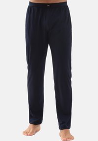 Donkerblauwe broek van zachte stof, met een elastische tailleband en rechte snit. Minimalistisch ontwerp, zonder zichtbare patronen of accenten.