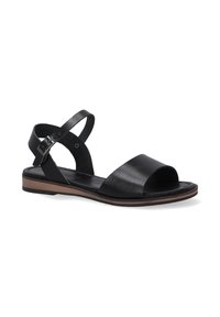 Sort lædersandal med åben tå, justerbar ankelrem og flad sål. Har en glat finish og en kontrasterende brun sål. Minimalistisk design.