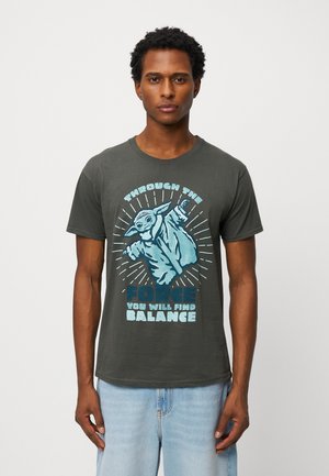 Dark gray cotton T-shirt featuring a graphic of a character in a light blue robe with the text, "Through the Force, You Will Find Balance."