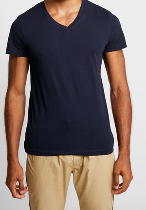 Granatowy, krótki rękaw, t-shirt z dekoltem w serek, wykonany z miękkiego materiału, o dopasowanym kroju i gładkiej fakturze. Prosty design, bez wzorów i zdobień.