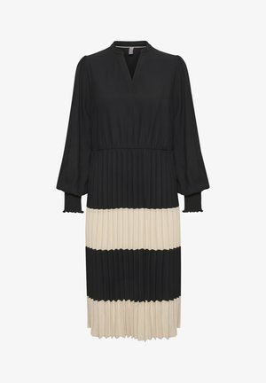 Black and cream pleated dress with a V-neck, long puff sleeves, and a fitted waist. Features alternating solid and pleated panels.