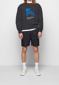 Han Kjøbenhavn Mikina - black