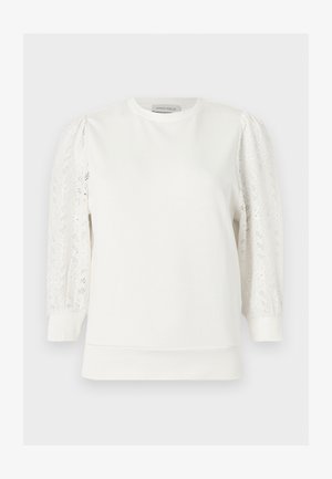 Hvit langermet topp med blonder og puff-ærmer, rund hals og tettsittende mansjetter, av Anna Field.