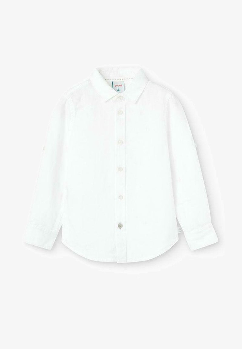 Chemise blanche à manches longues en tissu lisse, avec un col classique, une fermeture boutonnée sur le devant et un ourlet arrondi. Détails de couture subtils.