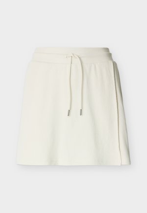 Valgekirju tekstuuriga seelik elastse vöökohaga ja nöörkinnitusega, mille nööril on metallotsikud.