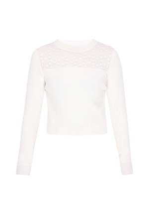 Fehér hosszú ujjú bordázott felső áttetsző virágos csipkés panellel a felső mellkason és a vállakon, kerek nyakkivágással.