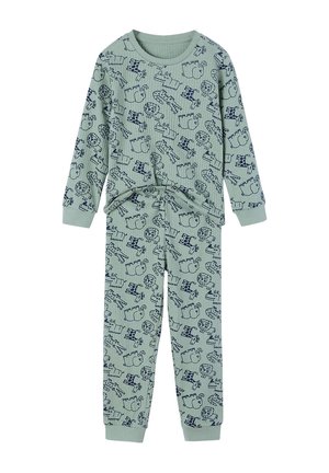Light green ribbed long-sleeve top and pants set with navy blue cartoon animal prints including lions, giraffes, and hippos.
