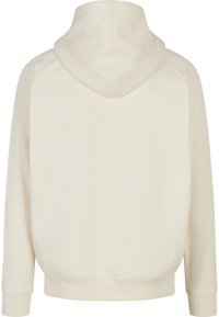 Hanorac cu glugă de culoare alb-crem, realizat dintr-un amestec moale de bumbac. Prezintă o croială lejeră, manșete rib și o suprafață texturată a materialului.