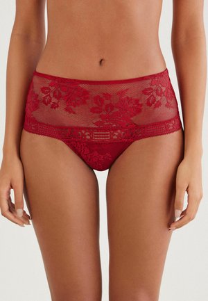 Red lace underwear featuring floral patterns, high waist design, and soft mesh texture, with detailed lace trim along the waistband and edges.