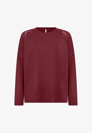 Burgundia pikkade varrukatega sviiter, millel on pitsiga aktsendid raglan varrukatel. Pehme kangas, lõdva istuvusega ja soonikkoes kaelus.