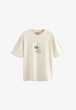 T-shirt en coton couleur crème à manches courtes, avec un graphique de Snoopy jouant au tennis et le texte "club snoopy" en dessous.