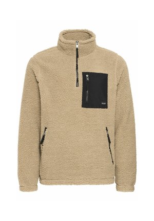 Beige fleece pullover with a half-zip collar. Features a black zippered chest pocket and two side zippered pockets. Soft texture.