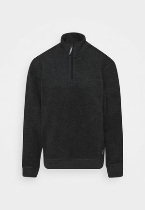 Black, zip neck sweatshirt with long sleeves, made from a soft, textured fabric. Features a slightly fitted design and ribbed cuffs.