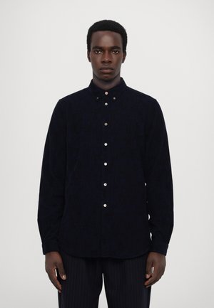 Navy blue button-up shirt made of textured fabric, featuring a classic collar and subtle patterns, with contrasting buttons and long sleeves.