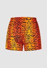 Boxer shorts with orange and red tiger stripe pattern featuring black smiley faces and the words "LOVIN" and "LOUSY" on fabric.