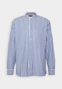 Sinivalkoraidallinen pitkähihainen paita, valmistettu kevyestä kankaasta, jossa on pystykaulus, napitus edessä ja yksi rintatasku.