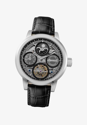 Silver-tone watch with a transparent face revealing intricate mechanisms, black leather strap with crocodile pattern, and dual time indicators.