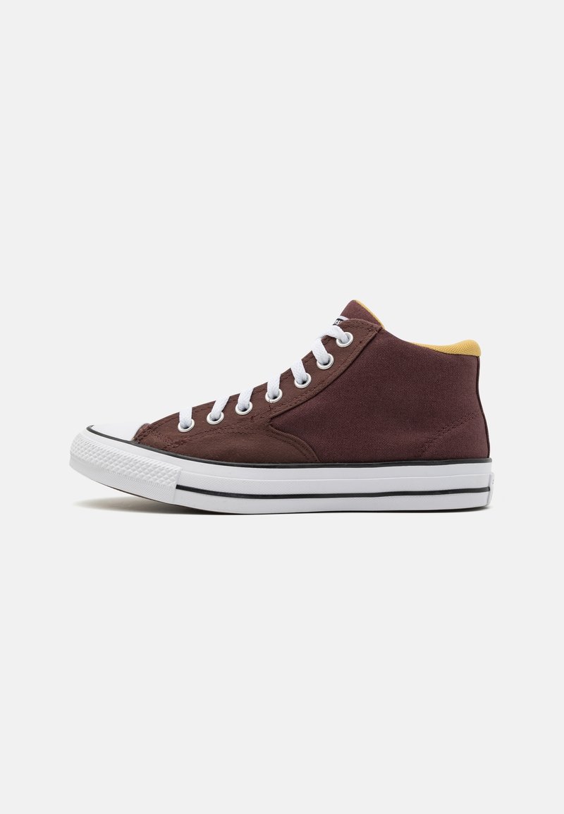 High-top sneakers in dark burgundy canvas with white eyelets, laces, and rubber sole. Features a yellow interior and black stripe along the base.