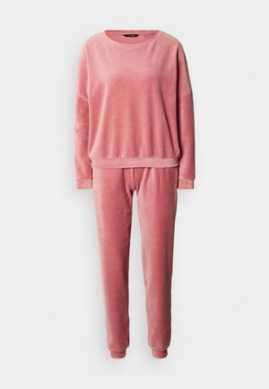 Loungewear-set in rozekleurige ribstof. Het bovenstuk heeft een ronde hals en verlaagde schouders; de broek heeft een elastische tailleband.
