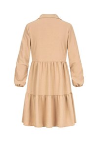 Beige pikkade varrukatega kleit kaelusetailiga, kihilise rüüdiga ja volditud mansettidega. Valmistatud pehmest, tekstureeritud kangast.