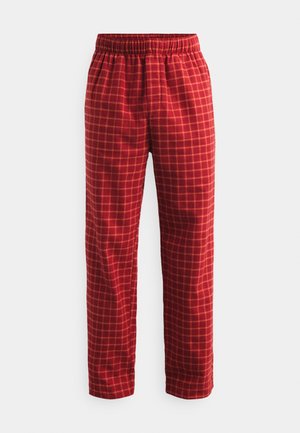 As calças de padrão xadrez vermelho apresentam uma cintura elástica, um corte reto e um tecido texturizado, exibindo um padrão de grelha em tons de laranja contrastantes.