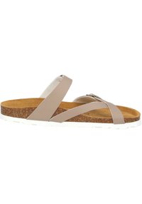 Beige slide sandal with two crisscross straps, cork footbed, and white rubber sole. Smooth texture with metallic accent on the strap.