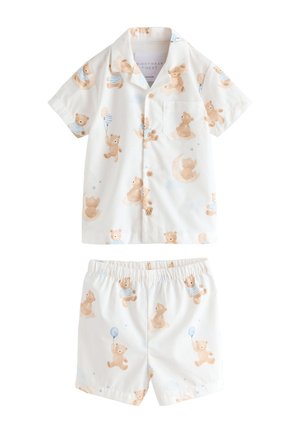 Kortærmet hvid børnepyjamas med knapper, med mønster af lysebrune teddybjørne, der holder balloner og sidder på måner.