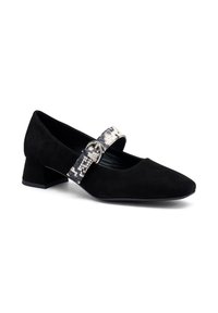 Scarpa Mary Jane in suede nero con punta quadrata, caratterizzata da una fibbia a strap con motivo argentato e nero lucido e un tacco basso a blocco.