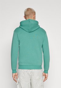 Jack & Jones JJEBRADLEY ZIP HOOD - Felpa con zip - bottle green
