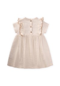 Robe en coton crème avec des manches courtes, un col à volants et une fermeture à boutons au dos, ornée de détails en tissu froncé pour plus de volume.