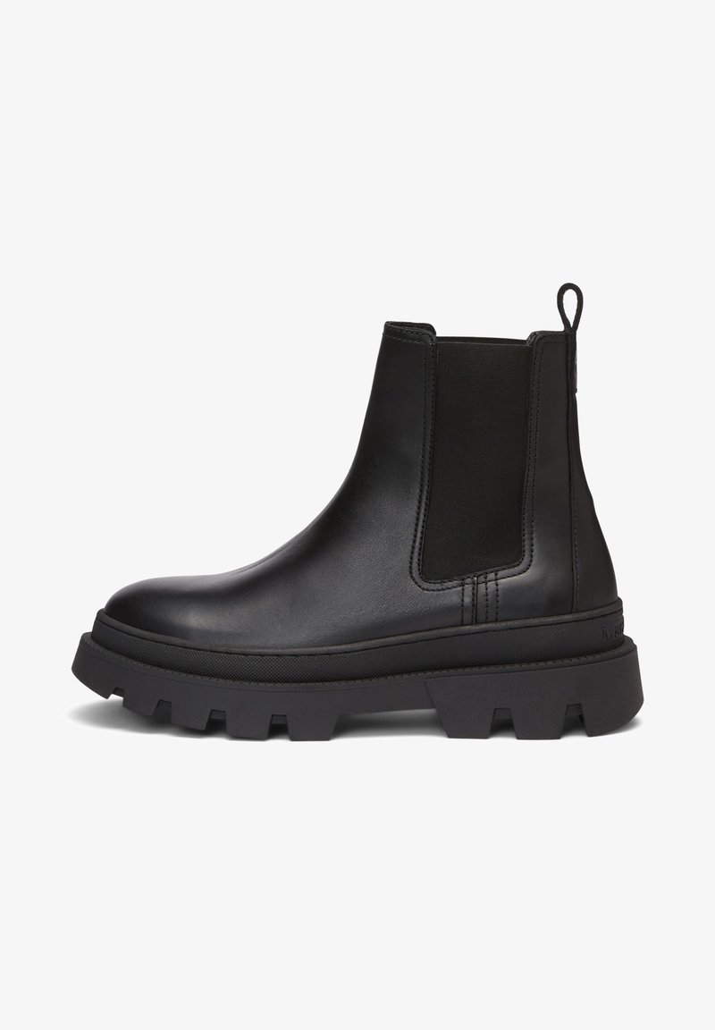 Botte Chelsea en cuir noir avec semelle crantée épaisse, panneau latéral élastique et languette à l'arrière.