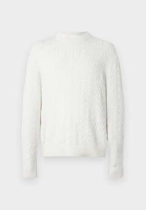 Valge nööridega kudumiga ümar kaelusega sviiter, millel on pikad varrukad ja soonikhed, esitatud lihtsal taustal.