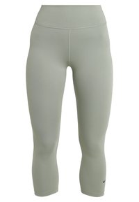 Světlezelené legíny s vysokým pasem, vyrobené z elastického materiálu, s plochými švy a malým logem poblíž kotníku.