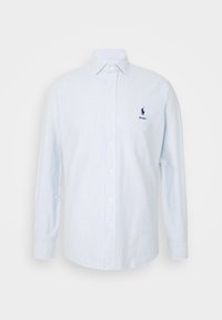 Ljusblå och vitrandig långärmad skjorta med krage, knappslå fram och en liten broderad logotyp på vänster bröst.