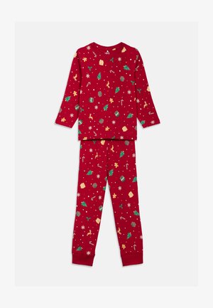 Red long-sleeve pajama set with white and green holiday patterns, including trees, gingerbread, and candy canes. Soft, relaxed fit.