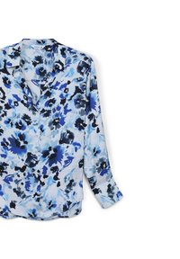 Camicia a maniche lunghe con bottoni, di colore azzurro chiaro, caratterizzata da motivi floreali neri e blu scuro, con colletto e orlo curvo. Realizzata in tessuto leggero.