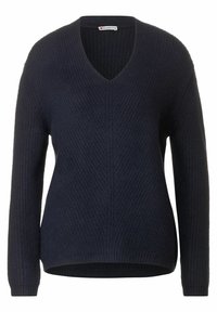 Pull col en V bleu marine avec texture côtel ée, manches longues et coupe décontractée. Comprend une couture centrale et un ourlet légèrement courbé.