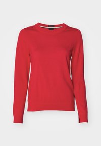 Κόκκινο πλεκτό πουλόβερ με μακριά μανίκια, στρογγυλή λαιμόκοψη και λεπτομέρειες με σχισίματα στο πλάι. Λείος υφή, εφαρμοστό σχέδιο και casual εμφάνιση.