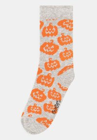 Gray socks with an orange pumpkin pattern, featuring a soft texture and a crew length design. Includes a small brand logo near the toe.