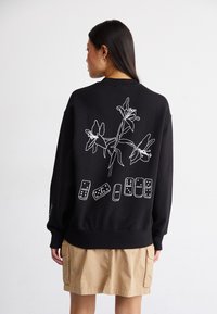 Carhartt WIP ISIS MARIA LUNCH - Sweatshirt - black/white
