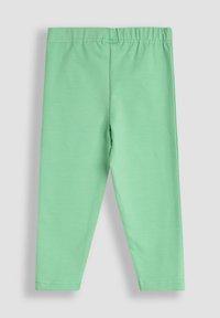 Leggings verdi in cotone con vita elastica, texture liscia e design aderente. Nessun motivo o decorazione visibile.