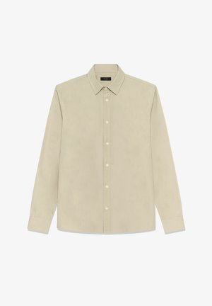 Lichtbeige overhemd met lange mouwen, gemaakt van zacht katoen. Heeft een button-down kraag, knopen aan de voorkant en een getailleerde pasvorm met manchetten aan de mouwen.