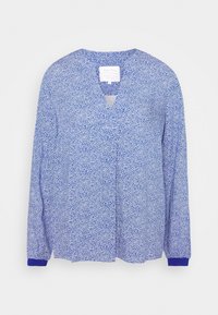 Blauwe blouse met lange mouwen en bloemenpatroon, voorzien van een V-hals, met een effen blauwe manchetten en lichtgewicht stof. Label zichtbaar in de hals.