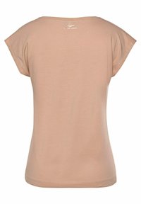 Short-sleeve, fitted T-shirt in light beige fabric, featuring a round neckline and a small logo detail at the back neck. Smooth texture.