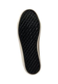 Semelle de chaussure en matériau caoutchouté noir avec un motif de semelle géométrique, bordée d'un contour synthétique de couleur claire.