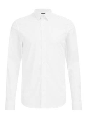 Chemise habillée à col blanc fabriquée dans un tissu lisse, dotée d'une rangée de boutons à l'avant, de longues manches et de poignets boutonnés.