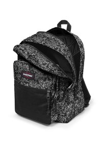 Zaino a motivi in bianco e nero con due scomparti con zip, dettagli in rete, spallacci imbottiti e una maniglia superiore per un facile trasporto.