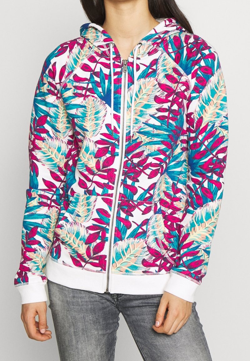 Hooded zip-up sweatshirt featuring a colorful floral pattern in pink, turquoise, and cream on a white background; ribbed cuffs and hem.