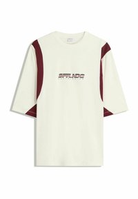Cream short-sleeve t-shirt with maroon side panels and graphic text "SOFT LOADING" in black and red stripes on the front. Smooth texture.